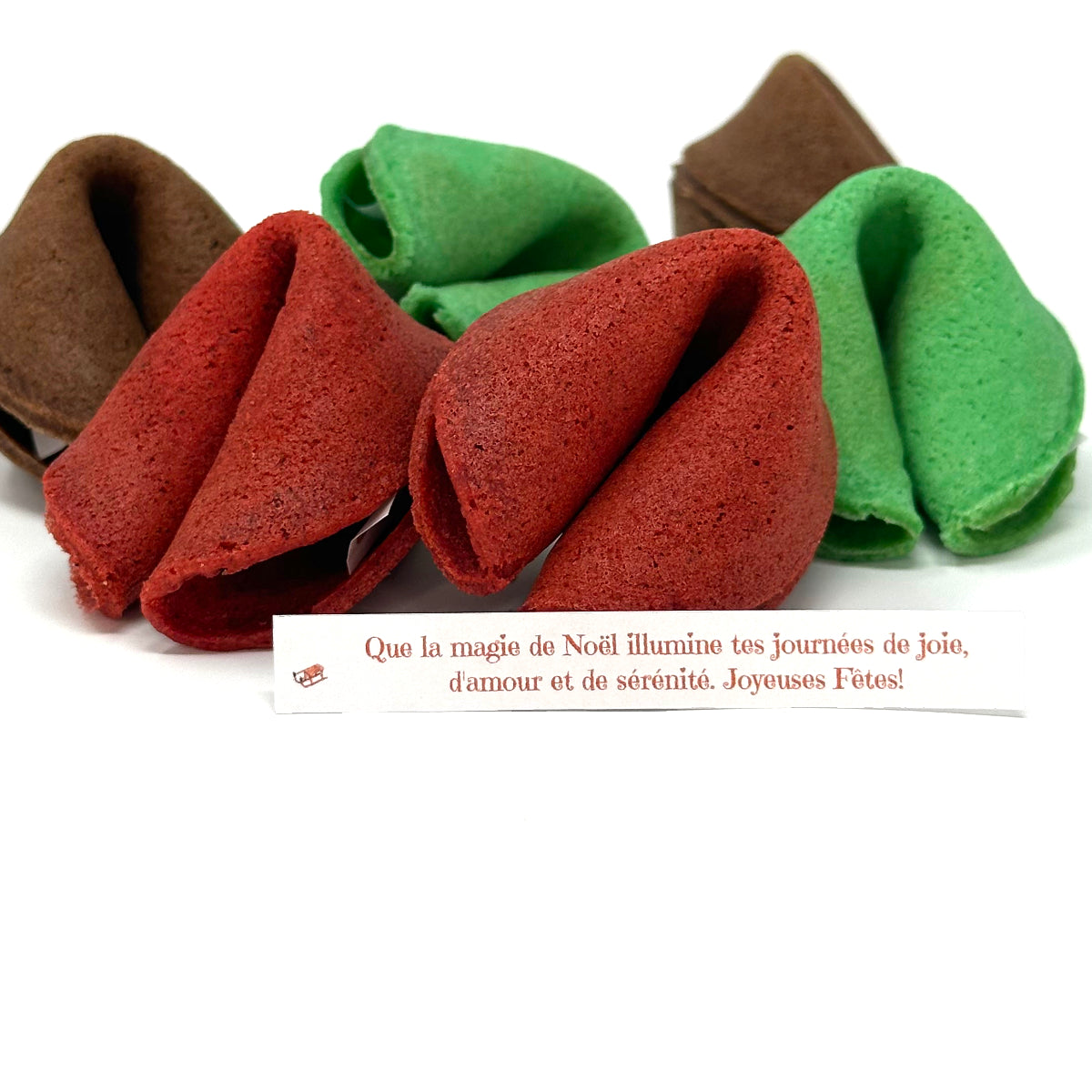 6 biscuits de fortune avec un exemple de message qui dit : "Que la magie de Noël illumine tes journées de joie, d'amour et de sérénité. Joyeuses Fêtes!"